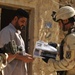 Iraqi Soldiers Distribute Information Pamphlets