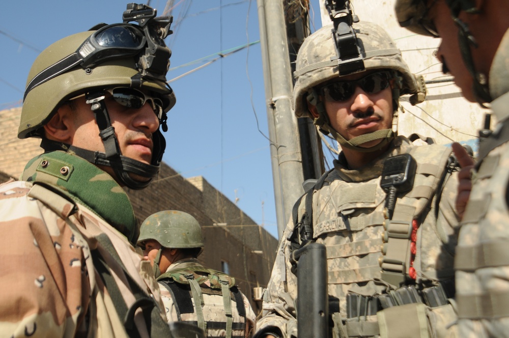 Iraqi Soldiers Distribute Information Pamphlets