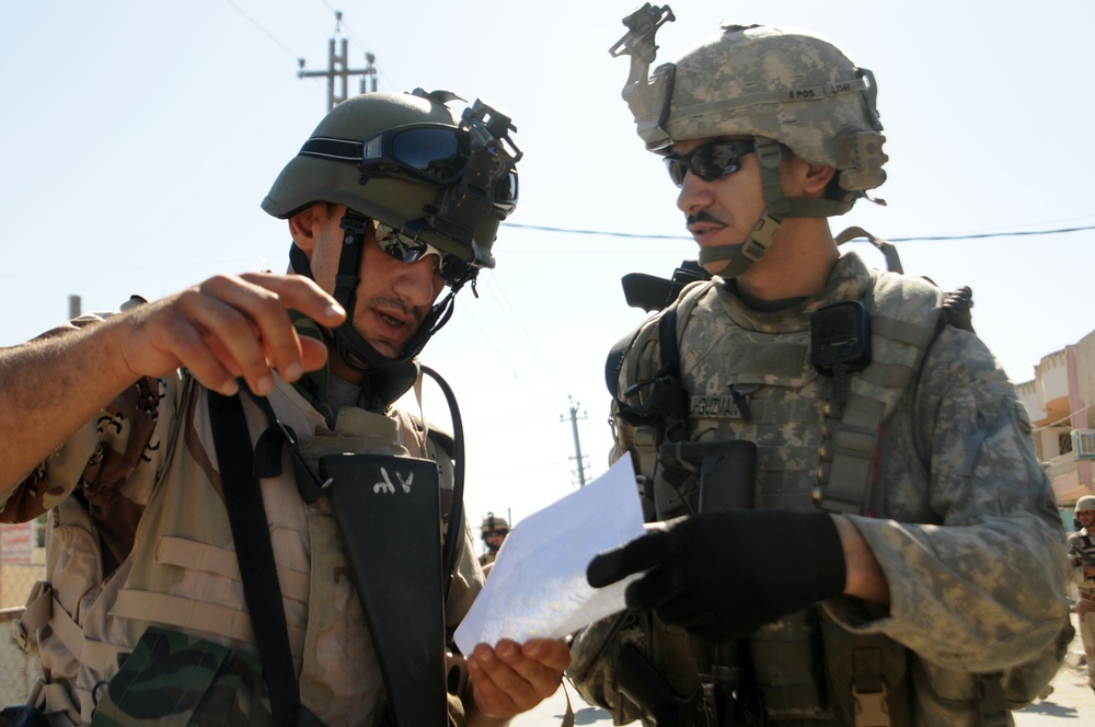Iraqi Soldiers Distribute Information Pamphlets