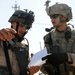 Iraqi Soldiers Distribute Information Pamphlets