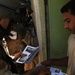 Iraqi Soldiers Distribute Information Pamphlets