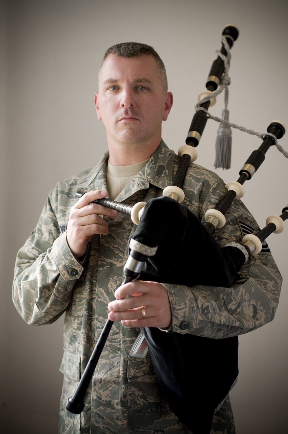 Airman Plays the Bagpipes in Honor of Fallen Comrades