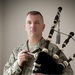 Airman Plays the Bagpipes in Honor of Fallen Comrades