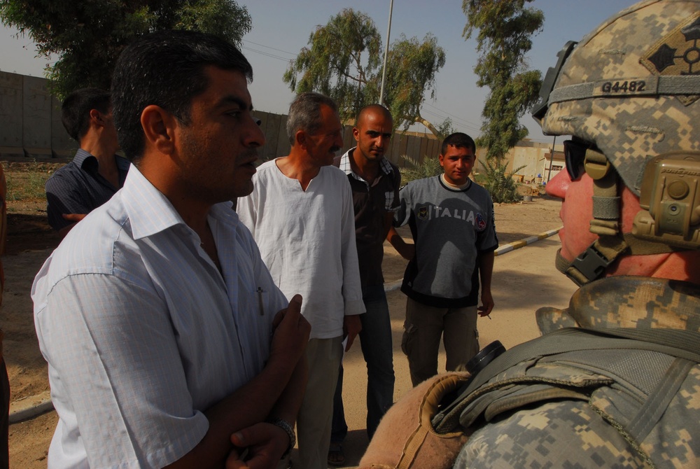 MND-B Soldiers transition Sons of Iraq into job-focused skills training at Rashid District's Civil Services Department
