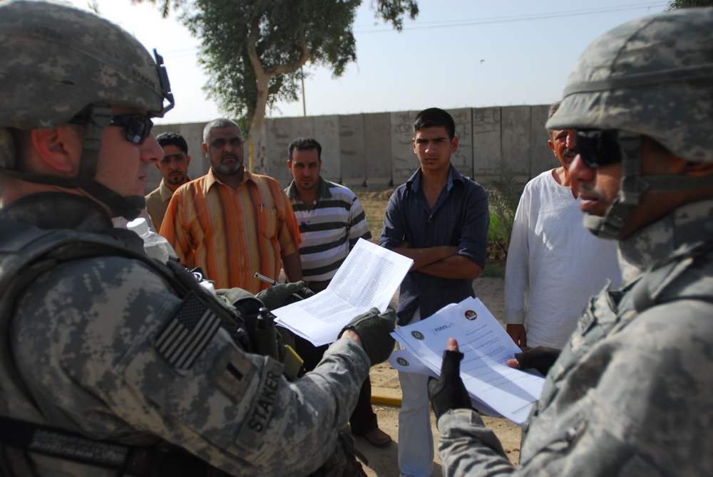 MND-B Soldiers transition Sons of Iraq into job-focused skills training at Rashid District's Civil Services Department