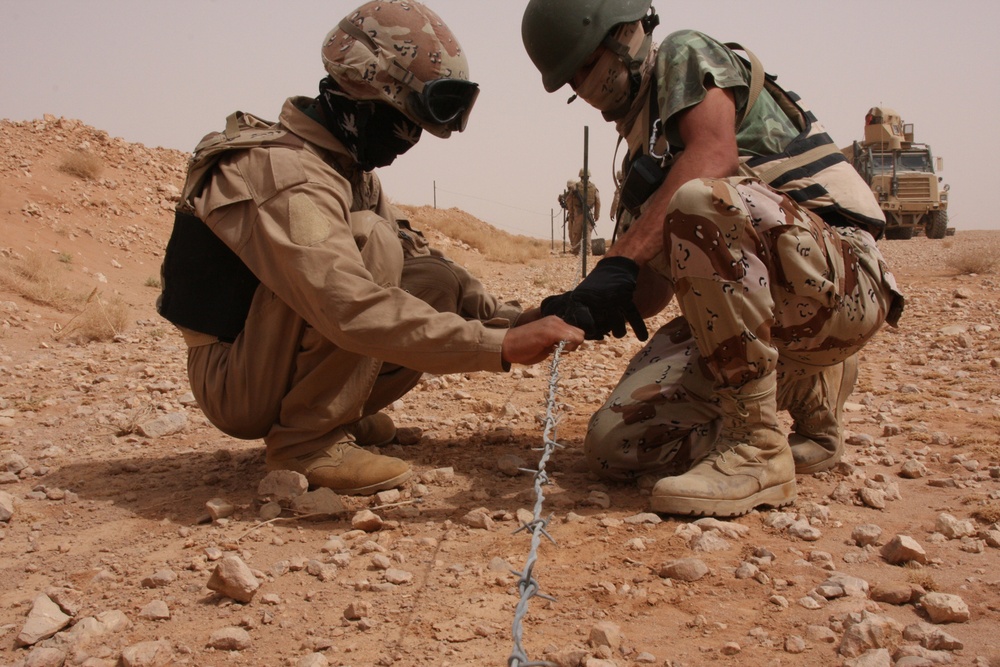 U.S. and Iraqi Soldiers Protect Locals