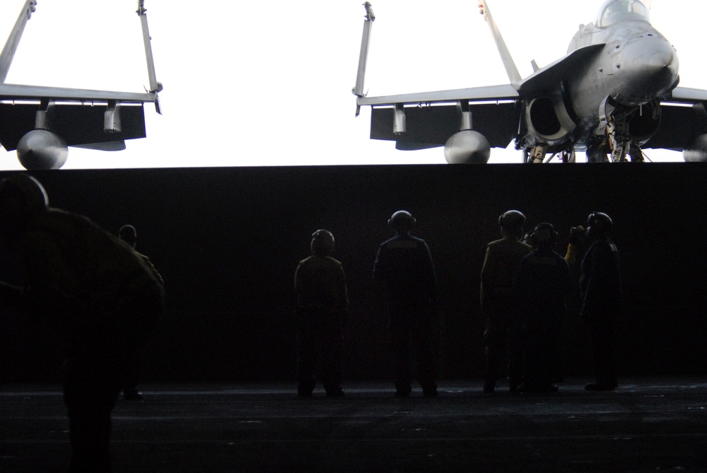 Working in the hangar bay aboard the USS Ronald Reagan