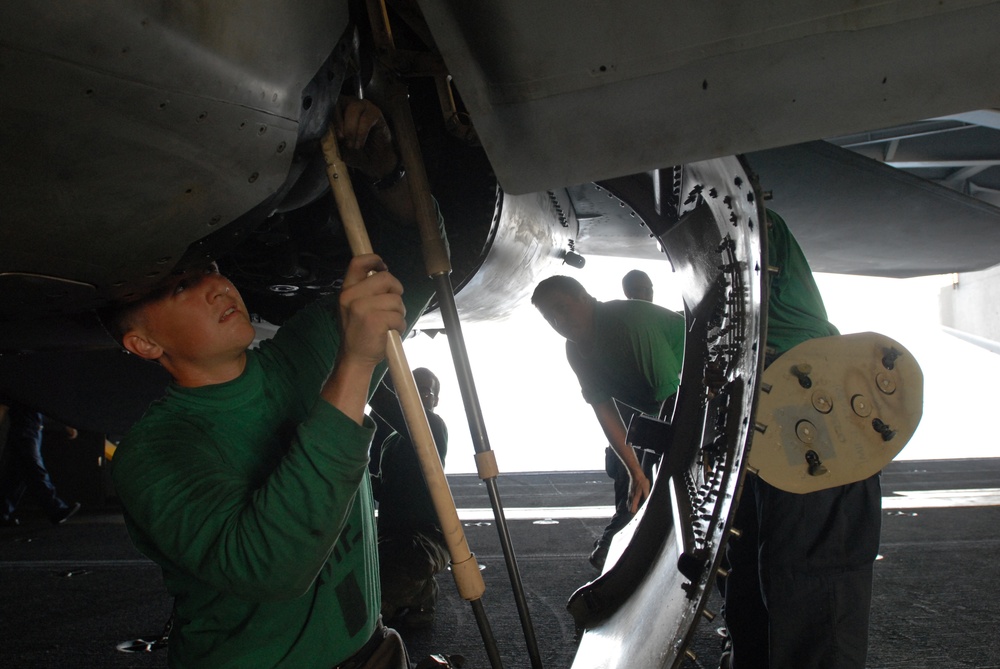 Working in the hangar bay aboard the USS Ronald Reagan