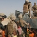 Troops distribute school supplies to Iraqi children