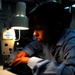 Sewing, steam-pressing aboard USS John C. Stennis