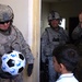 BSTB Soldiers pass out soccer balls to school children in Beladiyat