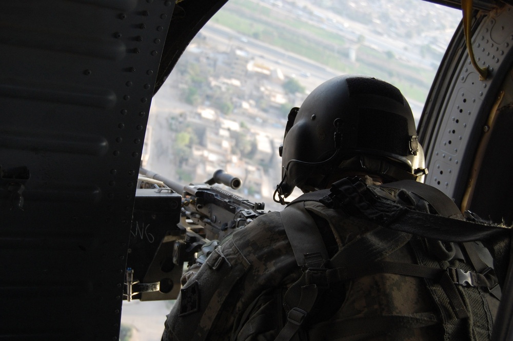 Blackhawk helicopter crew flying high over Baghdad