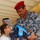 Iraqi national police distribute backpacks, smiles