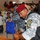 Iraqi national police distribute backpacks, smiles