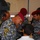 Iraqi national police distribute backpacks, smiles