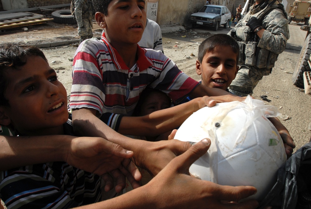 Near riot enriches lives of Iraqi children, Multi-National Division – Baghdad Soldiers