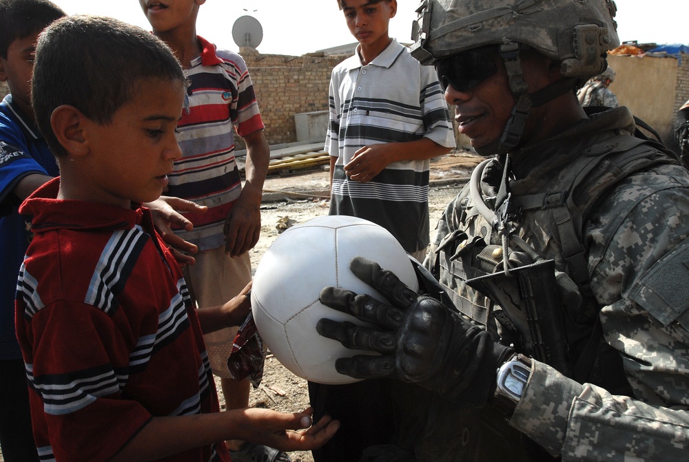 Near riot enriches lives of Iraqi children, Multi-National Division – Baghdad Soldiers