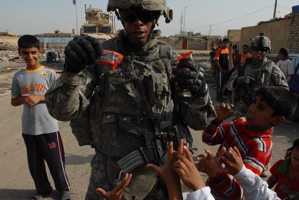 Near riot enriches lives of Iraqi children, Multi-National Division – Baghdad Soldiers