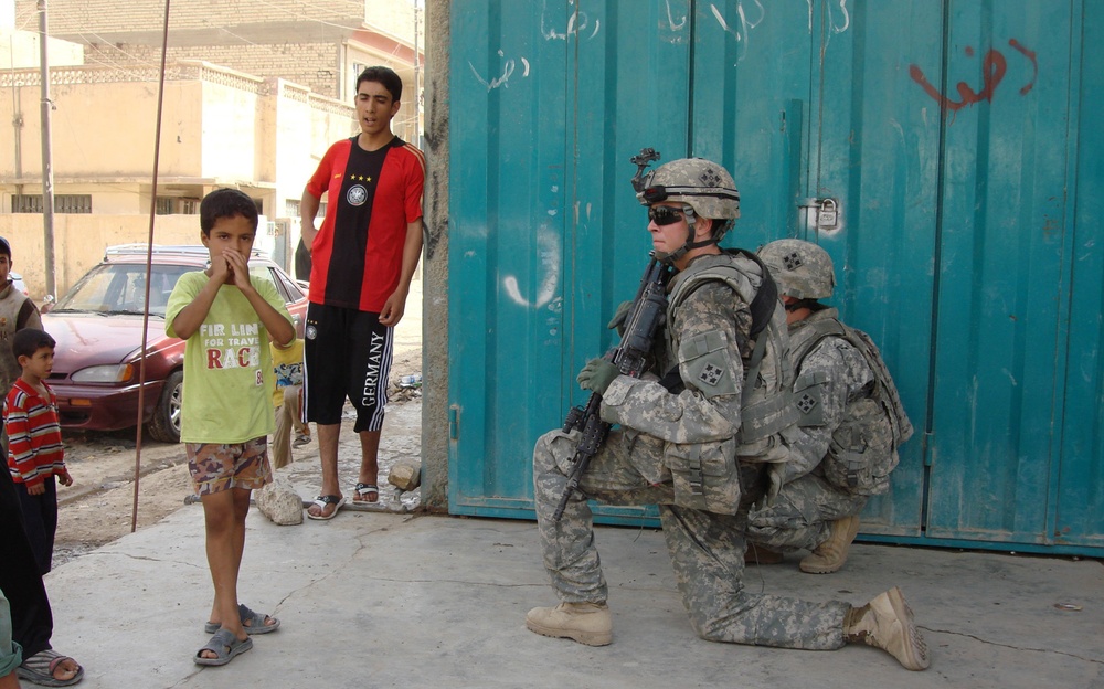 Iraqi security forces, Multi-National Division - Baghdad Soldiers patrol village in eastern Baghdad