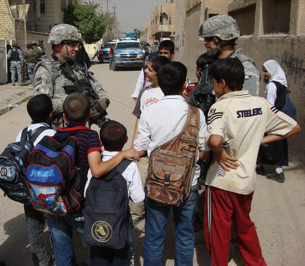Iraqi security forces, Multi-National Division - Baghdad Soldiers patrol village in eastern Baghdad