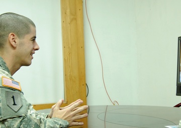 Soldiers share laughs, tears over video tele-conference