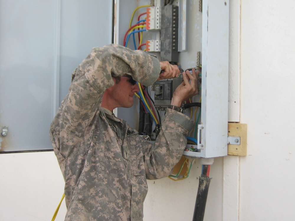 Engineers keep Soldiers safe - MND-B Soldiers upgrade electrical hot spots, safely bring power to remote areas