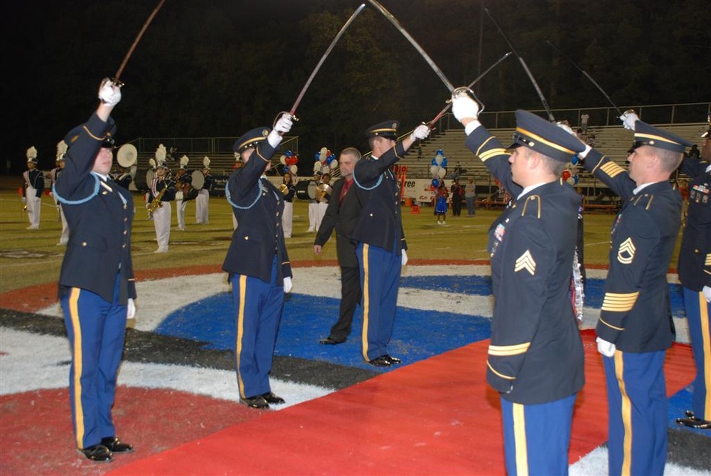 Local National Guard unit presents colors and sabers at area high school