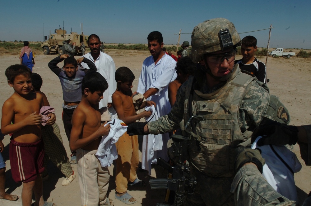 2nd Battalion, 320th Field Artillery Regiment Hands Out Soccer Equipment to Iraqi Children