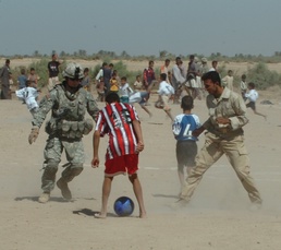 2nd Battalion, 320th Field Artillery Regiment Hands Out Soccer Equipment to Iraqi Children