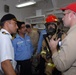 Indian navy sailors witness damage control drill aboard USS Thach