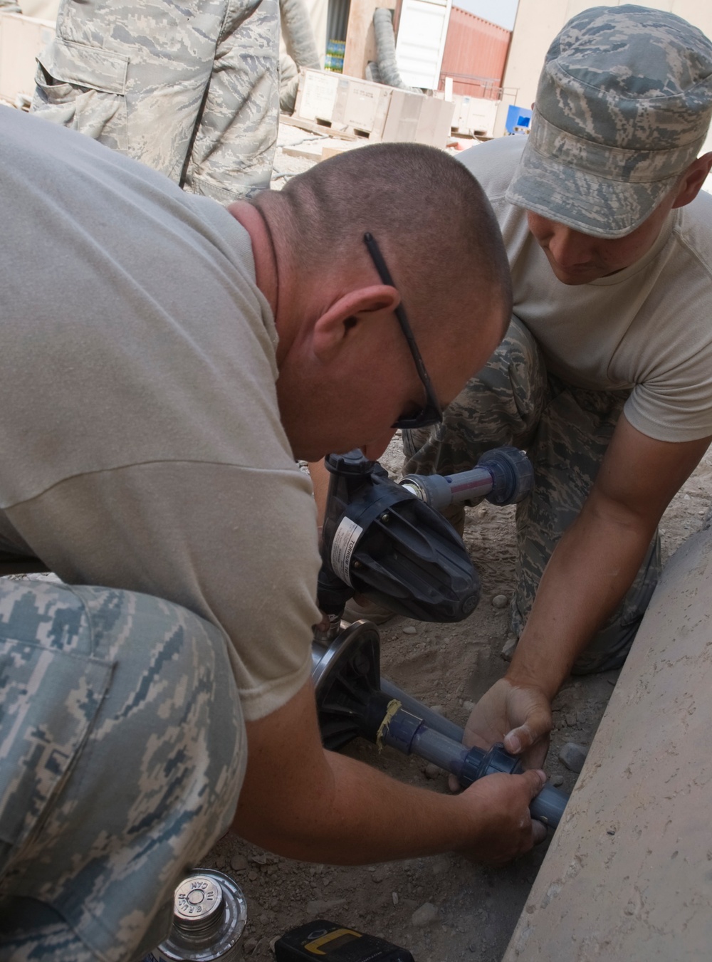 Airmen install water system