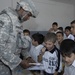 Iraqi army and U.S. Army hand out school supplies