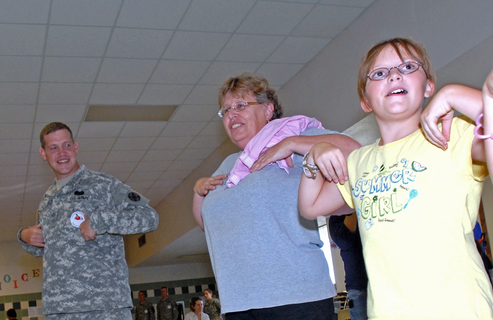15th  Sustainment Brigade Soldiers boogie with Clarke Elementary students
