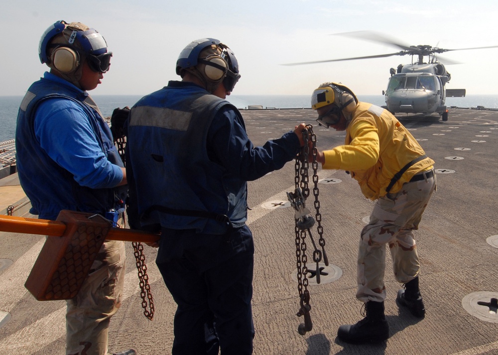 Directing the action aboard the USS Carter Hall