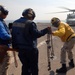 Directing the action aboard the USS Carter Hall