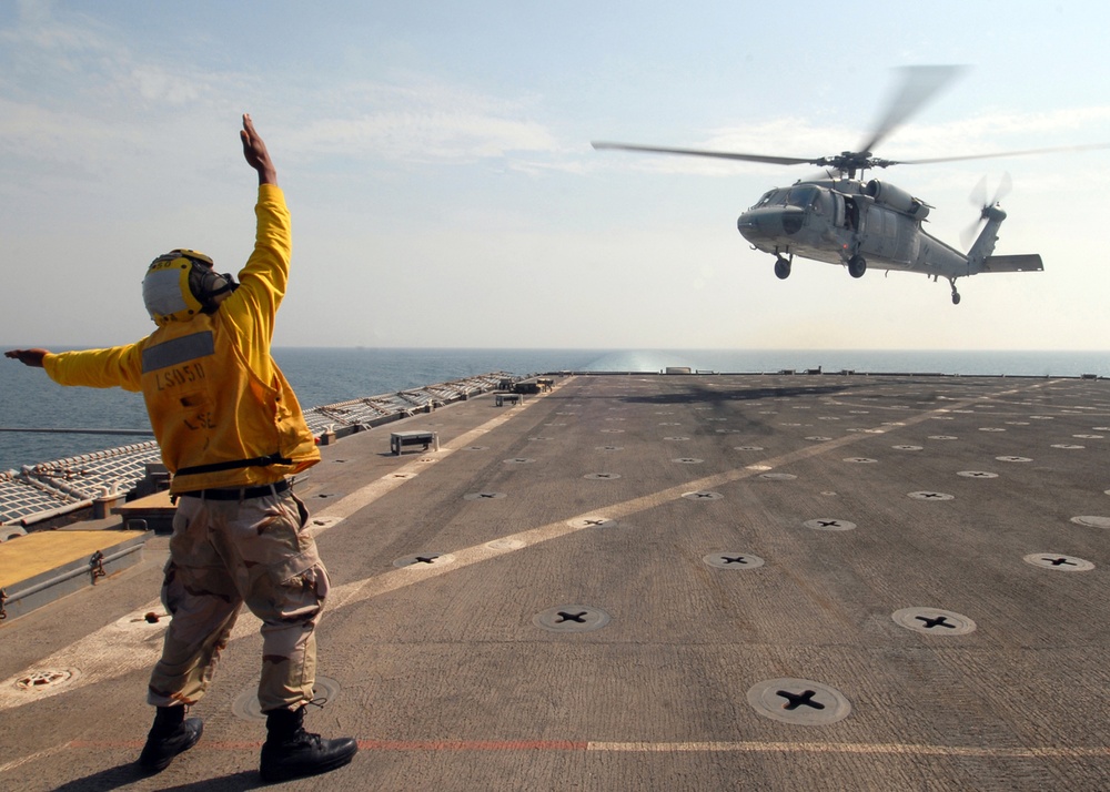 Directing the action aboard the USS Carter Hall