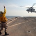 Directing the action aboard the USS Carter Hall