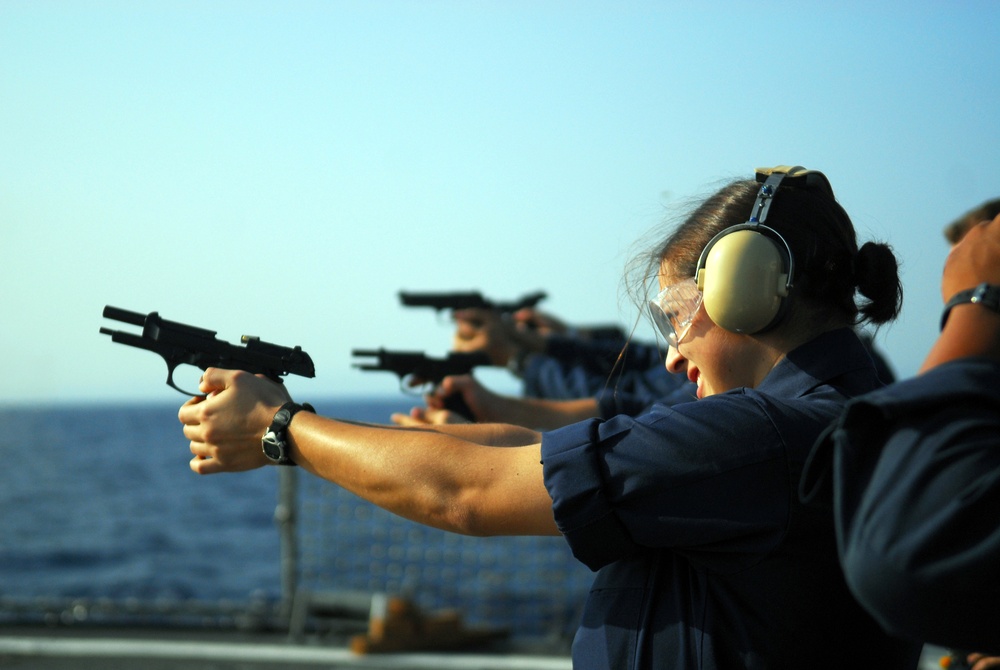 Firing away aboard the USS Mustin