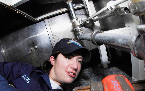 Tightening pipes aboard USS John C. Stennis