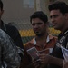 Iraqi national police, U.S. Soldiers hand out handbills