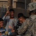 Iraqi national police, U.S. Soldiers hand out handbills