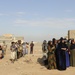 U.S. Soldiers hand out food and supplies