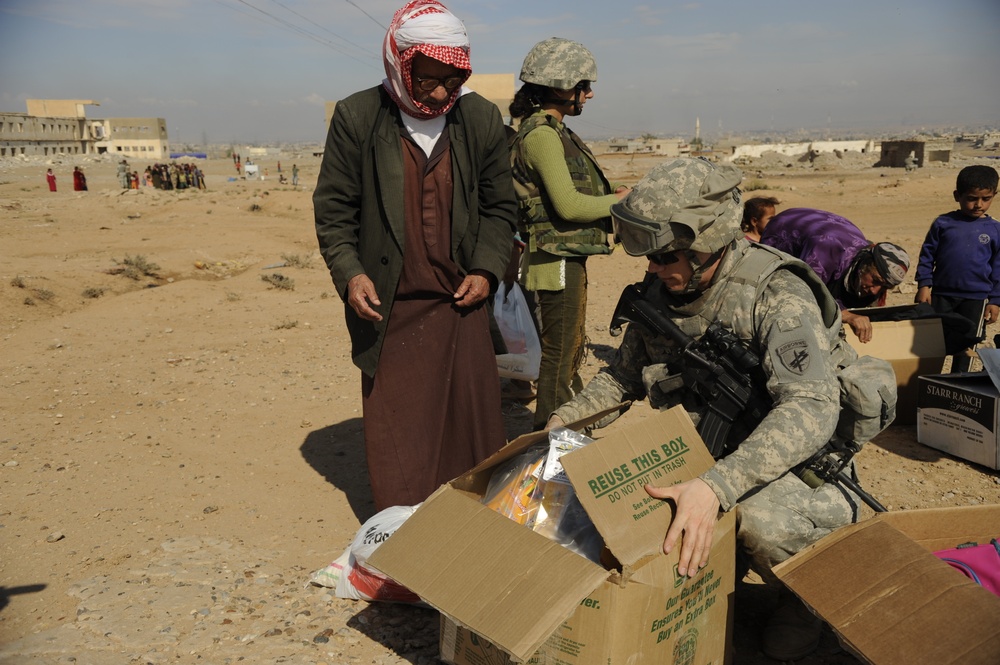 U.S. Soldiers Hand Out Food and Supplies