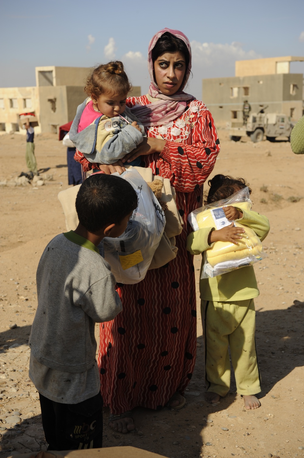 U.S. Soldiers hand out food and supplies