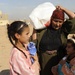 U.S. Soldiers hand out food and supplies