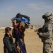 U.S. Soldiers hand out food and supplies