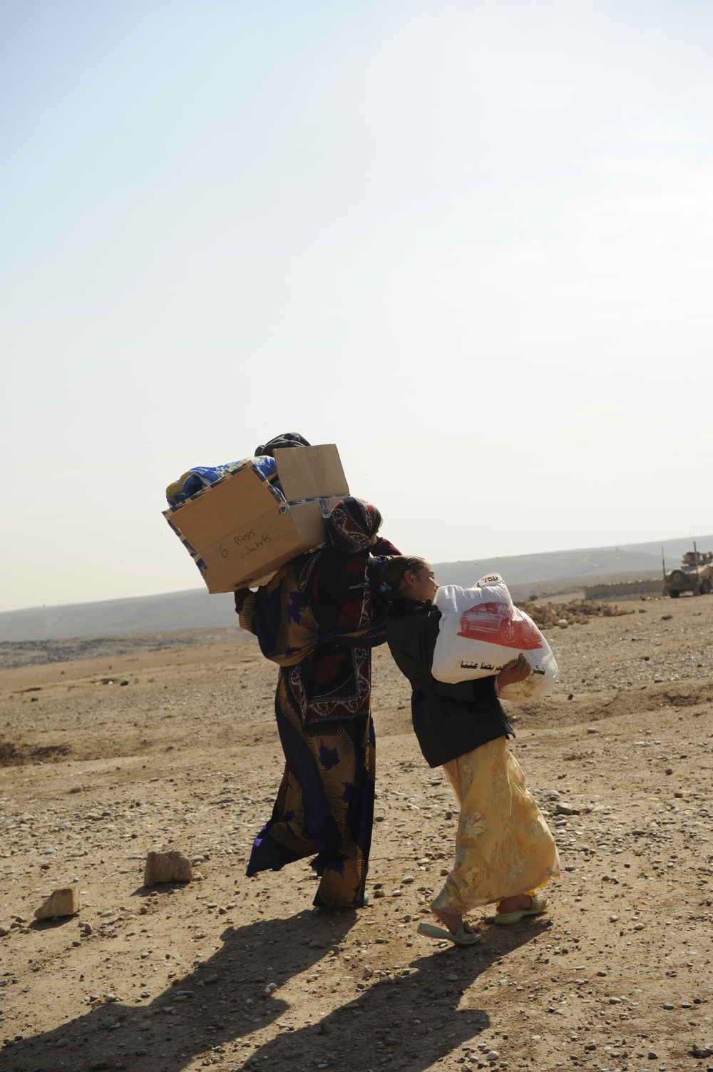 U.S. Soldiers hand out food and supplies