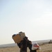 U.S. Soldiers hand out food and supplies