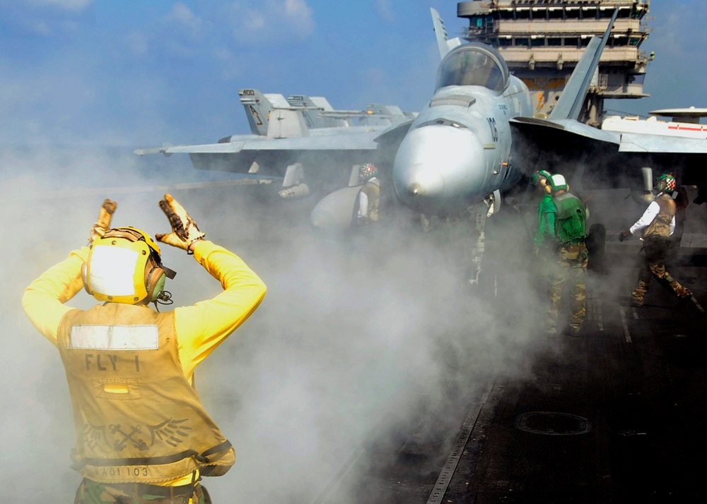 Launching Hornets aboard the USS Theodore Roosevelt