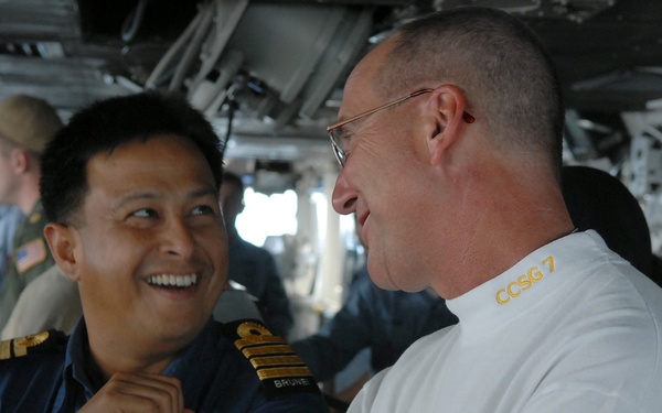 Members of Brunei military tour USS Ronald Reagan
